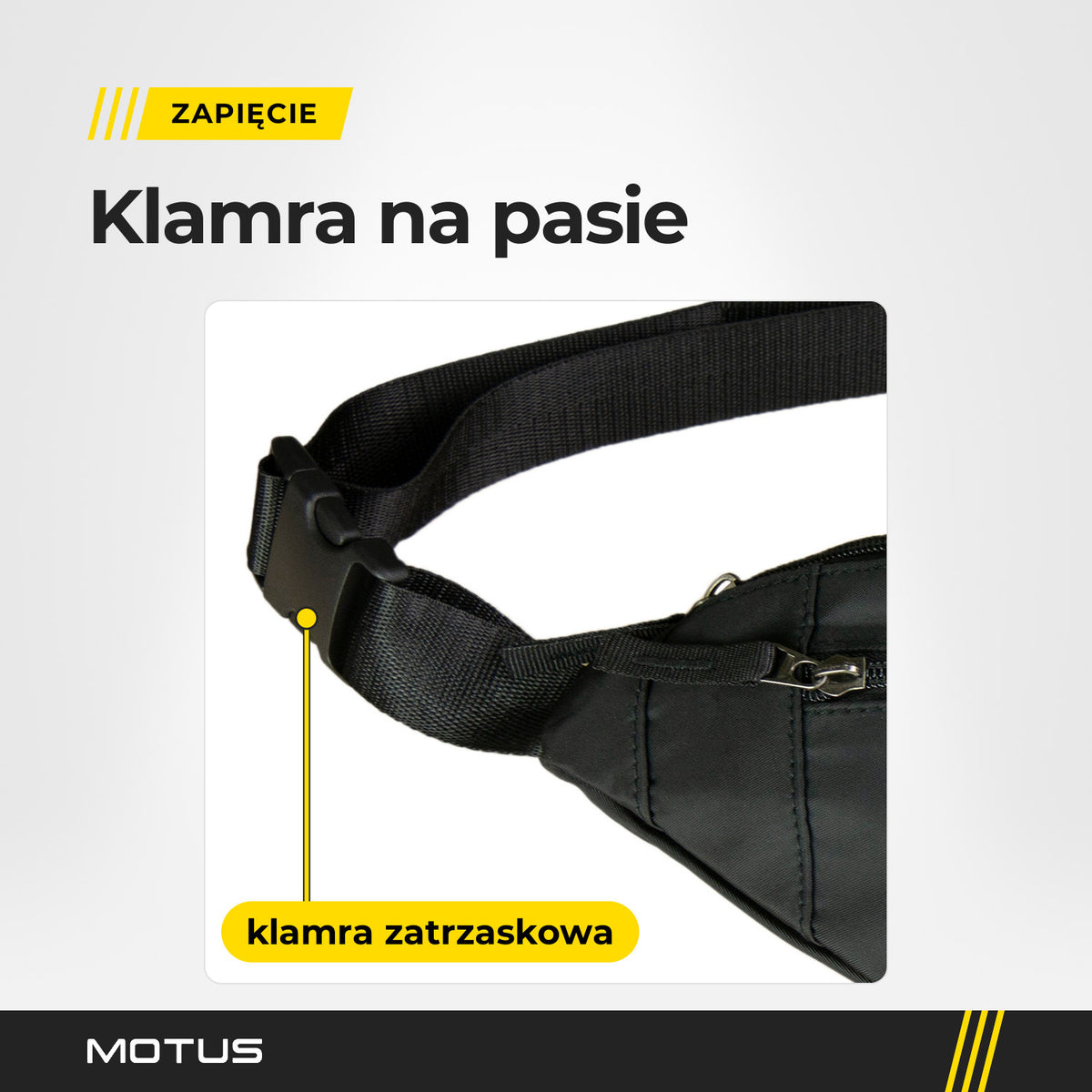 Klamra zatrzaskowa na pasie nerki MOTUS z bliska, obok suwak kieszeni z uchwytem z taśmy.