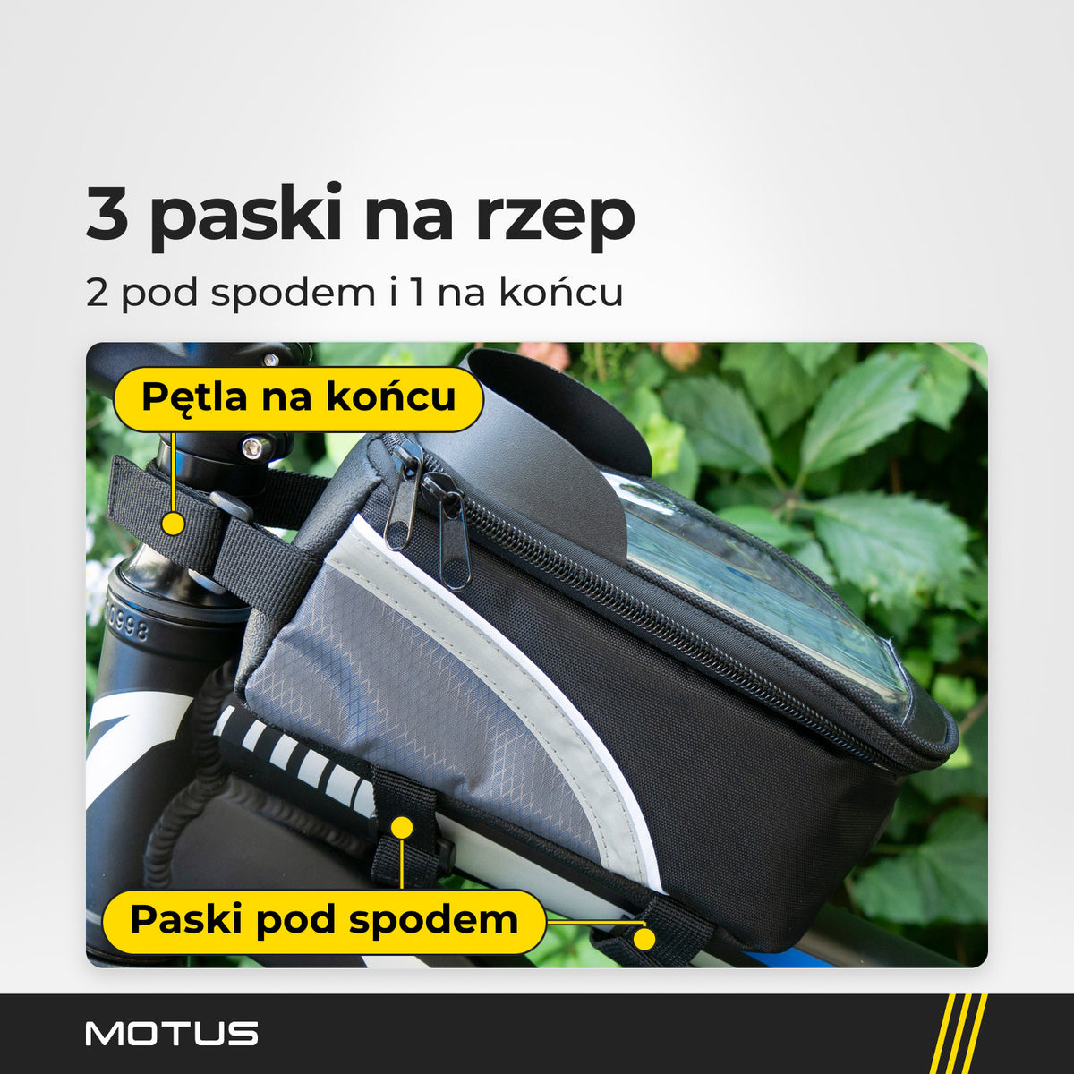 Torba rowerowa na ramę MOTUS na rowerze: 2 paski na rzep pod spodem obejmują ramę, a pętla na końcu zapina się przy kierownicy.